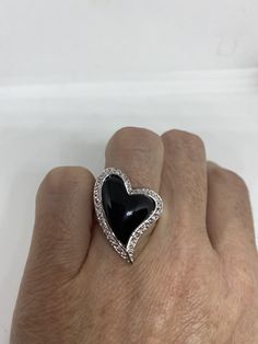 Vintage black onyx white sapphire ring 925 Sterling Silver Setting Size 6 Can be resized, my jeweler charges $10-$20 All rings are shipped free in the US in a nice gift box. Check out our over a THOUSAND great reviews Engraving is $4 per letter and is not always perfect depending on the piece. It can take a few days if the jeweler is busy. This is payable to Paypal Judithsltd@gmail.com Black Round Jewelry For Valentine's Day, Luxury Black Party Rings, Black Ring For Valentine's Day Formal Occasion, Black Rings For Valentine's Day Formal Occasion, Black Rings For Valentine's Day Formal Events, Black Sterling Silver Jewelry For Valentine's Day, Silver Heart-shaped Jewelry With Black Enamel, Black Cubic Zirconia Jewelry With Polished Finish, Black Diamond Rings For Party