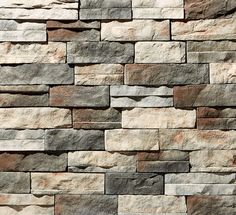 a stone wall that is made out of different colors