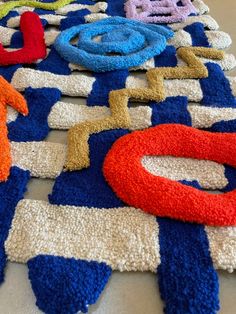 several different colored rugs laid out on the floor