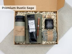 an open box containing various items such as coffee, pens and paper wrapped in twine