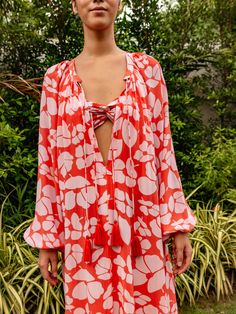 Embrace the thrill of summer and elevate your style with our Calista silk caftan. Crafted from luxurious silk crepe, it flaunts delicate tassels and a vibrant persimmon poppy print. The neckline is adorned with double tassels, exuding an extra touch of grace. Step into strappy sandals for a bold and chic look. The Calista Silk Caftan is the ultimate choice for warm weather, whether you're soaking up the sun at the beach or lounging by the pool. With its airy and effortless fit, it's perfect for throwing over a bathing suit or lounging in daring fashion! Color : Persimmon Poppy 100% Silk Crepe Relaxed Fit Tassels Silk Caftan, Poppy Print, Silk Maxi, Silk Maxi Dress, Persimmon, Silk Crepe, Strappy Sandals, Set Dress, Poppies