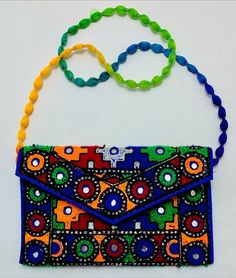 *This vibrant color cross bag is a perfect blend of colors and ethnic boho style. This unique bag is intricately crafted with affection by our South Asian craftsmen. This tribal bag features a mesmerizing array of colors, carefully handwoven by skilled artisans using high-quality materials.  *The intricate patterns and designs are handwoven on this tribal bag showcase the rich cultural heritage and craftsmanship of our talented craftsmen that goes into creating this exceptional piece. This allur Multicolor Clutch Mobile Phone Bag, Multicolor Clutch With Mobile Phone Bag, Multicolor Handmade Bags For Festivals, Handmade Multicolor Bags For Festivals, Handmade Multicolor Festival Bags, Multicolor Pouch Shoulder Bag For Mobile Phone, Multicolor Mobile Phone Pouch Shoulder Bag, Multicolor Shoulder Bag For Festivals, Multicolor Festival Pouch Bag