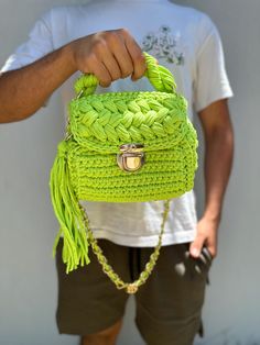 This handmade knitted green bag has a spacious interior and is a very cool piece. You can easily use this bag everywhere in your daily life. Green Knitted Bag For Daily Use, Trendy Green Knitted Bag, Green Knitted Shoulder Bag For Daily Use, Trendy Green Knitted Shoulder Bag, Green Crochet Pouch Bag For Daily Use, Green Crochet Bag With Braided Handles, Trendy Green Crochet Bag With Braided Handles, Green Knitted Shoulder Bag For Everyday, Green Knitted Bags For Everyday Use