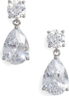 Free shipping and returns on Nordstrom Cubic Zirconia Teardrop Earrings at Nordstrom.com. Round- and pear-cut cubic zirconia make an elegant pairing in these dazzling drop earrings. White Gold Pear-shaped Teardrop Earrings With Cubic Zirconia, Dazzling Teardrop Earrings For Formal Occasions, Classic Teardrop Earrings With Sparkling Stones, Classic Teardrop Earrings In Brilliant Cut Cubic Zirconia, Teardrop Pendant Earrings In Cubic Zirconia, Classic Teardrop Earrings With Brilliant Cut Cubic Zirconia, Pear-shaped Teardrop Earrings With Diamond Accents, Classic Teardrop Diamond Cut Earrings, Classic Diamond Pear-shaped Cubic Zirconia Earrings