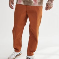 Super Nice Standard/Cloth Urban Outfitters Slim Fit Nylon Tech Pant In Terra Cotta! Slim Fit Cropped Inseam Stretch Nylon Pockets Hidden Zip Pocket At The Thigh Button & Zip Front Closure Urban Outfitters Exclusive Minor Hanger Marks (See Pics). Brand New Without Tags! Approx. 18.5" Waist Flat Approx. 13.25" Front Rise Approx. 27.5" Inseam Please See Pics For Fabric Content *H1434 12o Summer Hiking Pants With Cargo Pockets, Stretch Cotton Brown Cargo Pants, Stretch Brown Cargo Pants With Cargo Pockets, Stretch Brown Cotton Cargo Pants, Brown Stretch Cotton Cargo Pants, Relaxed Fit Bottoms For Outdoor Fall, Relaxed Fit Bottoms For Outdoor Fall Activities, Relaxed Fit Bottoms For Outdoor Fall Season, Stretch Nylon Hiking Pants