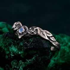 🌟 Warm Greetings, Jewelry Enthusiasts! 🌟 Step into a world where elegance meets personalization with our handcrafted silver rings. Each piece is a testament to unique artistry, blending mystical charm with modern finesse. Our collection offers a special touch for those who adore distinctive and thoughtfully designed jewelry. 🌈 Customization at Your Fingertips: Choose your perfect ring size and select from a variety of enchanting gemstones using our user-friendly dropdown menus. We delight in offering you the chance to create a ring that resonates with your personal style and story. ✨ Design It Your Way: Dreaming of a specific look? We're here to make it happen! Whether it's altering dimensions, adding extra gemstones, or choosing a different material, reach out to us. Your imagination i Nature-inspired Birthstone Rings For Gifts, Artisan Engraved Jewelry For Promise Ring, Artisan Engraved Promise Ring Jewelry, Nature-inspired Sterling Silver Rings With Birthstone, Nature-inspired Sterling Silver Birthstone Rings, White Gold Nature-inspired Jewelry For Promise, Artisan Engraved Promise Ring, Nature-inspired White Gold Promise Jewelry, Handmade Nature-inspired Moonstone Ring For Anniversary