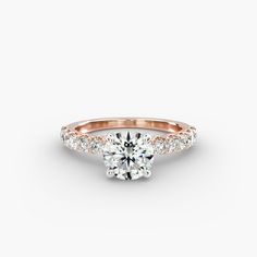 a rose gold engagement ring with diamonds on the side