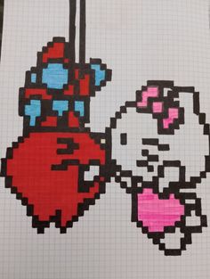 an image of hello kitty and pinkie cat hanging from a string on a piece of paper