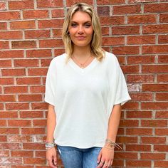 Introducing our chic and contemporary women's fashion top, where style meets comfort effortlessly. The cocoon sleeves add a modern twist, offering a relaxed yet flattering silhouette that drapes beautifully. Whether you're heading to a brunch date or a casual evening out, this versatile piece effortlessly transitions from day to night. Pair it with your favorite jeans for a laid-back vibe, or dress it up for a polished look. Fall Faves, Southern Women, Brunch Date, Casual Evening, Fashion Top, Oversized Tee, Short Rompers, Dress Romper, Polished Look