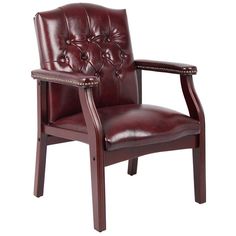 a brown leather chair with wooden legs and arm rests on an isolated white background,