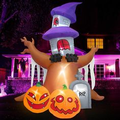 a large inflatable halloween decoration with pumpkins