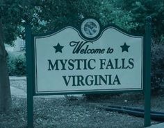 a welcome sign to mystic falls, virginia in black and white with stars on it