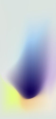 an abstract blurry background with blue, yellow and purple colors in the center is shown