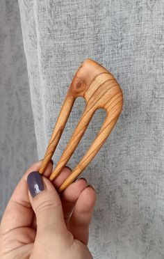 Overall length: 4,7 inches (12 cm) Functional prong length: 3,5 inches (8,9 cm) Top wide: 1,8 inches (4,5 cm) Hand Carved Wooden Hair Fork From the Cherry Wood. This hair fork is very smooth and easily slide into hair while holding it perfectly in shape. The wood has been treated with natural oil. To finalize the hair fork, it is polished to a high shine. Leaving you with not only a useful and functional tool but also a beautiful decoration for your hair. Great for all hair types: straight, wavy Wooden Hair Pins Handmade, Hair Accessories Bun, Stick Wood, Eco Beauty, Eco Friendly Accessories, Hair Fork, Hang Loose, Beauty Equipment, Hair Stick