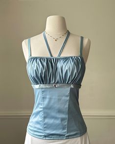 - Vintage frosted blue corset top featuring ruched satin bust with square neckline - hook-and-eye back closure; rhinestone adorned; slight framed bodice- size S, bust 34B- excellent condition with no flaws 🤍Model Measurements:- Bust: 34B- Waist: 26- Hip: 38- Height: 5"4 🤍 Size of mannequin: size 2 - 4 Fitted Ruched Corset With Spaghetti Straps, Satin Ruched Corset With Fitted Bodice, Elegant Ruched Corset With Spaghetti Straps, Satin Sleeveless Corset With Ruched Bodice, Sleeveless Satin Corset With Ruched Bodice, Elegant Fitted Prom Top, Evening Corset With Square Neck And Fitted Bodice, Evening Square Neck Corset With Fitted Bodice, Elegant Satin Top With Corset Back