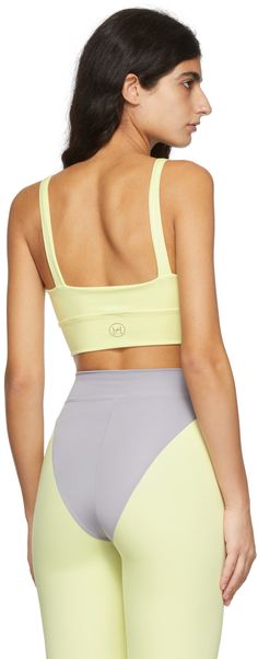 Italian recycled stretch polyester interlock jersey sport top. · Scoop neck · Logo printed at back hem · Fully lined Available exclusively at SSENSE. Supplier color: Tender yellow Yellow Sportswear Top For Workout, Sporty Seamless Yellow Activewear, Sporty Yellow Seamless Activewear, Yellow Seamless Sporty Activewear, Yellow Fitted Sportswear Top, Yellow Athleisure Tops For Sports, Yellow Seamless Athleisure Activewear, Stretch Yellow Tops With Moisture-wicking, Yellow Seamless Activewear For Gym