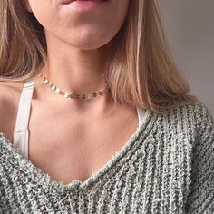 ✧ T H E ~ G O L D ~ C O I N ~ C H O K E R ✧ ✧ Pretty and simple, gold tone coin chain choker necklace. ✧ Fits 12-14", including extender chain.   ✧ Model wears at approx 12". ✧ Also available in silver, check out my other listings! ✧ S H I P P I N G ✧ Please note, 'standard shipping' does not include tracking. Only 'tracked' or 'express' orders include tracking and/or signatures on delivery (country dependant).  ✧ Please note that shipping time does not include production times.  ✧ Please see ou Gold Disk Necklace, Disk Necklace, Gold Layered Necklace, Circle Chain, Gold Disc Necklace, Choker Gold, Gold Disc, Gold Circle, Gold Necklace Layered