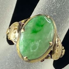 One Antique 14k Yellow Gold Ring, It Four Prong Setting One Natural Green Jadeite Cabochon, 14.6 X 9.62mm, Moss Green Patina, Decorated Etching On The Shanks, A Ring Tension Bar On The Base For Size Adjustment. Ring Top Is 16.3 X 11.2mm, Ring Size 6, Weight 3.6gm, Tested And Hallmark 14k (1 Inch = 25.4 Mm; 1 Dime = 17.9mm). All Items Are Pre-Owned Unless Otherwise Stated. This Means They Have The Usual Aspects Of Pre-Owned Jewelry, Such As Light Scratches, Wear And Tarnish. Please Review All The Photos Which Will Be Part Of The Description. Jr7377 Green Opal Oval Ring In 14k Gold, Green Emerald Oval Cabochon Ring Stamped 14k, Oval Jade Rings In Yellow Gold, Heirloom Green Oval Cabochon Rings, Oval Jade Rings Hallmarked, Classic Green Oval Opal Ring, Green Oval Opal Ring, Heirloom Green Oval Opal Ring, Green Oval Heirloom Jewelry