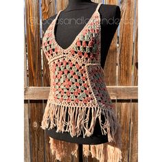 Step into summer with this handmade crochet granny square top/swimsuit coverup dress, complete with trendy fringe detailing. This versatile piece exudes perfect boho hippie vibes, making it a must-have for your summer wardrobe. Crafted with a blend of 100% cotton and bamboo yarns, this lightweight and breathable coverup is ideal for warm days by the beach or pool. The intricate granny square design adds a touch of retro charm, while the fringe accents give it a playful and free-spirited feel. Perfect for sizes small to medium, this coverup dress is the perfect blend of style and comfort for all your summer adventures. Embrace the carefree spirit of bohemian fashion with this unique and stylish crochet creation. Pattern: The High Low Boho Top by Cozy Creative Crochets Granny Square Tank Top, Granny Square Tank, Crochet Granny Square Top, Square Tank Top, Granny Square Top, Swimsuit Coverup Dress, Trendy Fringe, Boho Mode, Coverup Dress