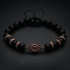 "top jewelry gifts for men and women, gifts for boyfriend, unique gifts ideasRose gold evil eye jewelry Exclusive handmade bracelet made with 8mm Faceted Matte Onyx beads, featuring Rose Gold plated 925 Silver Evil eye charm embellished with black Zircon stones. There are 3 rose gold plated Black Zircon Spacer beads on each side of the evil eye charm. It's adjustable, utilizing a sliding knot made with macrame cord and is easy to put on and take off by yourself. Please choose one of the 2 size o Gold Evil Eye Jewelry, Silver Jewelry For Men, Horn Pendant Necklace, Men's Bracelets, Bracelets Design, Design Bracelet, Bracelet Mens, Moon Pendant Necklace, Jewelry For Men