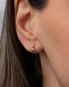 A mini version of a popular stud, these 14K Gold Mini Teardrop Stud Earrings add a touch of luxury to any ear stack. From a strapless gown to a classic white tee, these earrings elevate your style with their curvaceous, mini bubbly design. Effortless and feminine, they are a trendy must-have for the fashion-forward woman. Size: Approx. 3.46mm(W) x 7.6mm(H) Total Weight: Approx. .76 grams (per pair) Standard Production: 3-5 business days Rush Order Production: 2-3 business days Shipping: Select s 14k White Gold Teardrop Huggie Earrings, 14k Gold Teardrop Huggie Earrings Fine Jewelry, 14k Gold Teardrop Huggie Earrings, Formal Teardrop Huggie Earrings, Formal 14k Gold Teardrop Huggie Earrings, Minimalist Rose Gold Teardrop Huggie Earrings, Classic Rose Gold Teardrop Earrings, Classic Teardrop Huggie Earrings For Anniversary, 14k Gold Teardrop Earrings