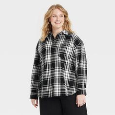 This Oversized Flannel Long-Sleeve Collared Button-Down Shirt from Universal Thread™ makes a versatile addition to your wardrobe. Made from midweight cotton, this collared shirt features a front button placket, long sleeves with buttoned cuffs, a patch pocket on the chest and a box-pleat back yoke for classic touches. The oversized fit and shirttail hemline complete the design, allowing you to wear it tucked in, untucked, layered open and unbuttoned, or with rolled-up sleeves. Universal Thread™: Oversized Collared Winter Blouse, Oversized Collared Blouse For Winter, Oversized Black Flannel Shirt For Fall, Oversized Button-up Winter Shirt, Winter Oversized Button-up Shirt, Oversized Black Button-up Flannel Shirt, Oversized Plaid Top For Daywear, Oversized Long Sleeve Flannel Shirt With Buttons, Oversized Flannel