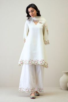 White kurta with floral embroidered scallop detail and high low hem. Paired with matching pant and dupatta. - Aza Fashions Eid V-neck Kurta With Intricate Embroidery, Elegant V-neck Kurta With Floral Embroidery, Traditional Embroidered V-neck Palazzo Set, V-neck Wedding Sets With Floral Embroidery, Unstitched V-neck Sets For Spring, Traditional V-neck Sets With Embroidered Neckline, Designer Palazzo Set With Embroidered Border For Spring, Spring Chikankari Embroidery V-neck Set, Spring Designer Wear Palazzo Set With Embroidered Border