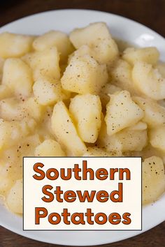 a white bowl filled with potatoes sitting on top of a wooden table next to a sign that says southern stewed potatoes