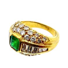 18K yellow gold ring with emerald center stone, accentuated with diamonds.    Sophia D by Joseph Dardashti LTD has been known worldwide for 35 years and are inspired by classic Art Deco design that merges with modern manufacturing techniques. Gold Emerald Ring With Pavé Setting, Gold Emerald Ring With Pave Setting, Gold Emerald Cut Ring With Pave Setting, Luxury Gold Emerald Ring With Pave Setting, Gold Emerald Rings With Pave Setting, Gold Ring With Emerald, Ring With Emerald, 18k Yellow Gold Ring, Yellow Gold Ring