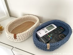 there is a remote control and a basket on the counter