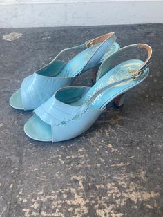 Vintage Amano Light Blue Sandal Heels marked size 7. In great vintage condition - showing some wear throughout. Beautifully Italian made leather heels in a perfect light sky blue color. Approx. Measurements: Heel height: 3 2/3" Length: 7.5 Light Blue Open Heel Strap Heels, Light Blue Open Heel Heels With Strap, Vintage Formal Sandals With 4-inch Heel, Vintage Heels With Deep Heel Cup For Summer, Blue Open Heel With Leather Sole, Blue Open Heel Heels With Leather Sole, Formal Light Blue Sandals With Padded Heel, Light Blue Open Heel Formal Heels, Formal Light Blue Open Heel Heels