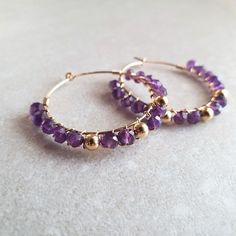 Amethyst Beaded Hoop Earrings These elegant Amethyst 14k gold-filled hoop earrings are a true reflection of artisanal craftsmanship, handmade with love in London, UK. Featuring natural, faceted Amethyst beads, each stone is carefully selected to create a piece that shines with timeless beauty and style. The 14k gold-filled hoop earrings with 14k gold-filled beads and natural amethyst gemstones add a touch of luxury, making them a perfect addition to any jewelry collection. ♡ SIZE ♡ These hoop ea Love In London, Beaded Diy, 14k Gold Hoop Earrings, Gemstone Properties, Earrings Beaded, Amethyst Jewelry, Amethyst Beads, Beaded Hoop Earrings, Beaded Hoops