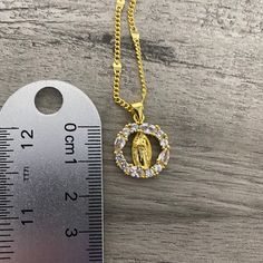 -Gold plated necklace with cubic zirconia -Chain measures: 18” long + 2” extensor (2MM thickness) same as picture -Pendant measures: 1.7cm x 1.7cm Cubic Zirconia Pendant Charm Necklaces With Adjustable Chain, Cubic Zirconia Crystal Pendant Necklace With Clavicle Chain, Gold Cubic Zirconia Crystal Pendant Necklace, Gold Cubic Zirconia Pendant Necklace, Gift Cubic Zirconia Chain Necklace, Cubic Zirconia Rhinestone Pendant Necklace, Cubic Zirconia Plated Necklaces, Virgencita Necklace, Keychain Necklace