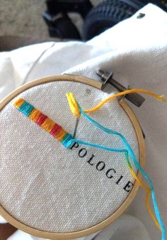 a cross stitch project with the word police on it