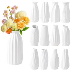 there are many white vases with different flowers in them on the same side,