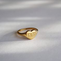 Featuring a heart-shaped design, the ring is adorned with the meaningful 11:11 inscription—a symbol often associated with wishes, alignment, and positive transformations. The 11:11 Heart Ring is a beautiful reminder that magic and love are always within reach. Make a wish and let this ring be your guide to aligning with your highest self and embracing the journey ahead. -stainless steel, gold plated 11:11 Ring, Highest Self, Central African, Congo Kinshasa, Jewelry Case, The Ring, Ring Ring, Make A Wish, British Indian Ocean Territory