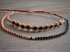 This 2 piece beaded floral bracelet set features 2mm copper color seed beads strung on 0.5mm waxed cord. With an adjustable slide closure that accommodates wrist sizes 6-8 inches, this 2 piece set is perfect for anyone looking for a comfortable and customizable fit. This dainty duo is perfect for layering or wearing solo - The minimalist macrame design adds a boho flair to any outfit. Return policy: Each bracelet is handmade to order, therefore I can only accept returns on torn or unraveling sli Handmade Adjustable Copper Beaded Bracelets, Adjustable Beaded Copper Bracelets, Adjustable Rose Gold Friendship Bracelet With Sliding Knot, Adjustable Rose Gold Bracelets For Beach, Adjustable Brown Copper Braided Bracelets, Adjustable Minimalist Macrame Jewelry, Minimalist Adjustable Macrame Jewelry, Adjustable Rose Gold Bracelets With Cord, Adjustable Rose Gold Cord Bracelet