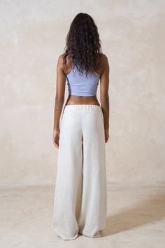 Our Baggy Linen Trousers are the perfect embodiment of joy and rebellion. These relaxed-fit beauties can be styled high, mid, or low on the waist, giving you options for any look. With wide legs that flow with every step, they feature an elastic band at the waist for maximum comfort. Perfect for lounging, running errands, or soaking up the sun, these pants are all about fun and freedom. THE trousers that defy convention and inspire you to live boldly. Choose your fit: high waist, mid waist, low How To Style Linen Pants, Live Boldly, Baggy Trousers, Belly Chain, Linen Trousers, Wide Legs, Top Collection, Low Waist, Linen Pants