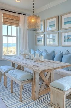 a dining room table surrounded by blue pillows