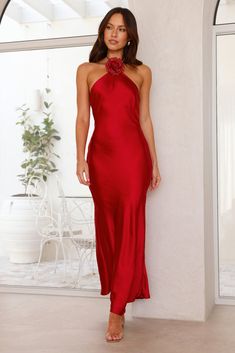 Length from bust to hem of size S: 137cm. Chest: 36cm, Waist: 34cm, across front only of size S. Maxi dress. Unlined. Model is a standard XS and is wearing size XS. True to size. Non-stretch. Satin. Halter tie. Two flower brooches with glitter detail. Zipper with hook eye closure. Cold hand wash only. Polyester. Gorgeous 'fits only! The Admired By All Satin Halter Maxi Dress features a halter tie, silky satin and the dreamiest flower brooches with glitter details that you can place anywhere on t Strapless Red Dress, Elegant Red Dresses, Red Halter Dress, Elegant Red Dress, Red Strapless Dress, Red Party, Halter Maxi, Windsor Dresses, Halter Maxi Dresses