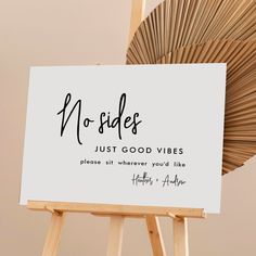 a wooden easel holding a sign that says no sides just good vibes please air wherever you'd like