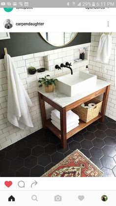 the bathroom is decorated in black and white with touches of yellow to give it an eclectic feel