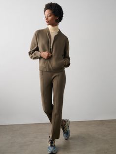 These double-knit cotton pants combine the comfort of sweats with the refinement of tailoring. An elastic waistband ensures comfortable all-day wear, while raised seams elongate the legs. Style it with the coordinating jacket on travel days, or dress it up with a collared shirt during the week. Details Inseam Length in size small is 27". The model is 5'9 1/2" and is wearing a size small. 79% Organic Cotton, 21% Lycra. Hand wash cold or dry clean. Do not twist or wring. Reshape and lay flat to dr Flare Pant, Kick Flares, Matching Pants, Double Knit, Collared Shirt, White Tee, Cotton Pants, Knit Jacket, Double Knitting