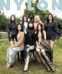 the cover of nylon japan, featuring models in black and brown outfits sitting on a bench