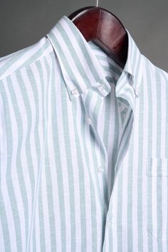 A bespoke shirt crafted from a textured cotton blend fabric in an oversized candy stripe. The larger striped pattern gives it a punch of style, making it a great casual shirt that can be worn with chinos or jeans - or under suits and jackets. The lightweight fabric drapes effortlessly, making it an ideal choice for those seeking a sophisticated yet relaxed look. White Relaxed Fit Yarn-dyed Shirt, Striped Relaxed Fit Shirt For Business Casual, Casual Striped Shirt For Business, Casual Striped Shirt For Business Casual, Pinstripe Shirt For Business Casual, Spring Cotton Dress Shirt With Striped Collar, Casual Pinstripe Shirt For Business Casual, White Cotton Shirt With Horizontal Stripe Pattern, White Cotton Shirt With Horizontal Stripes