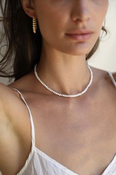 "Simple, light but never understated. Our new freshwater Pearl Layering Necklace choker is the perfect pearl pairing to our Pearl Drop Layering Necklaces. Wear them alone for a subtle touch or together to add bold layers. Or get 2 necklaces for getting the double choker look ✤ Available in 14k Gold Filled or Sterling Silver (findings) ✤ Aprox. 5mm freshwater pearl ✤ Tarnish resistant ✤ Safe for sensitive skin ✤ Available size 14\" 15\" 16\" ✤ Model is wearing size - 14\" + 1\" extension and same Akoya Pearl Charm Beaded Necklaces For Wedding, Akoya Pearl Beaded Necklaces With Pearl Charm For Wedding, Wedding Akoya Pearl Beaded Necklaces With Pearl Charm, Wedding Akoya Pearl Beaded Necklace With Pearl Charm, Dainty Single Strand Beaded Necklaces For Wedding, Dainty Single Strand Beaded Necklace For Wedding, Delicate Beaded Pearl Drop Necklaces, Delicate Beaded Pearl Necklace, Minimalist Beaded Pearl Necklace For Wedding