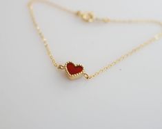 Tiny and dainty red agate heart filled with love and passion, such a perfect present for Valentine's Day and your loved ones. :: Style name: RDHRT-ENLB1004 :: Heart size: 7x7.5mm :: Material: 14k solid yellow gold :: Stone type: red agate Notes :: Jewelries are measured in millimeters and centimeters. :: Please read store policy before placing order. :: In stock items are ready to ship in 3 business days, made to order items are ready to ship in 2-4 weeks. :: International Shipping AVAILABLE. :: Minimalist Red Heart-shaped Jewelry, Dainty Red Jewelry For Everyday, Delicate Red Jewelry For Valentine's Day, Delicate Red Valentine's Day Jewelry, Red 14k Gold Dainty Bracelet, Red Dainty Heart Charm Bracelet, Red Heart Charm Fine Jewelry, Fine Jewelry Bracelets For Valentine's Day Gift, Elegant Red Bracelets With Heart Charm