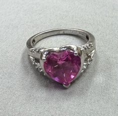 Vintage marked P4SR for silver,platinum & palladium mixed alloy ring size 7 with pink cubic heart zirconia stone. Pink Heart Cut Ruby Ring For Valentine's Day, Pink Heart-shaped Cubic Zirconia Diamond Ring, Pink Sterling Silver Heart Ring With Center Stone, Pink Cubic Zirconia Heart Ring For Anniversary, Pink Heart Cut Ruby Ring For Gift, Pink Heart-shaped Crystal Ring For Anniversary, Pink Ruby Ring For Valentine's Day, Pink Heart Crystal Ring For Anniversary, Pink Heart-shaped Birthstone Promise Ring