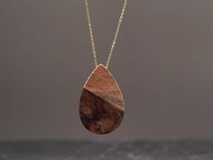 Natural Wood Resin Pendant/Tear Drop Shape Necklace/Handcrafted Walnut Wood & Grey Resin Teardrop Necklace/Wood Resin Pendant/Gift for Her G L I M M E R G R O V ∙ T R E N D Y ∙ J E W E L R Y Embrace the allure of handmade luxury with this exquisite Wood and Resin teardrop pendant necklace. The Tear drop shaped grey resin wood pendant radiates a sense of natural beauty and grace. Indulge in the intricate craftsmanship of this handcrafted jewelry piece, designed to accentuate your personal style. Necklace Wood, Wood Necklace, Teardrop Necklace, Wood Pendant, Wood Resin, Resin Pendant, Tear Drop, Walnut Wood, Handcrafted Jewelry