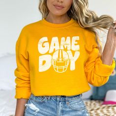 Perfect for any football fan! Lots of colors to choose from! Show your team spirit with this awesome sweatshirt! 50/50 Cotton & Polyester Blend.  Fit: All shirts are unisex fit, true to size, loose fit. Recommend going up 1-2 sizes for an oversized look. Please check the size chart. If you have any questions, please contact us. Please check your address to make sure it is your current address. Care Instructions:  For the best and lasting results, wash in cold water inside out. No bleach. Dry on low heat or hang dry. Do not iron over design.  Returns: Because this item is made to order, all sales are final. No returns are accepted.  Please let us know if you have a problem with your order and we will try to correct the issue.  Shipping: Orders usually ship within 3 business days. Please all Game Day Fan Apparel T-shirt With Crew Neck, Crew Neck T-shirt For Game Day, Fan Apparel, Crew Neck Tops For Football Season Game Day, Game Day Team Spirit Crew Neck T-shirt, Game Day Crew T-shirt For Sports Season, Game Day Crew T-shirt With Team Spirit, Team Spirit Crew T-shirt For Game Day, Crew Neck T-shirt For Game Day With Team Spirit, Crew Neck T-shirt For Game Day In Fall